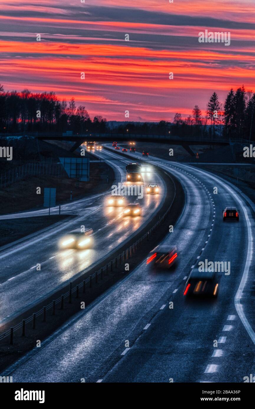 Cars on the motorway in the evening Stock Photo