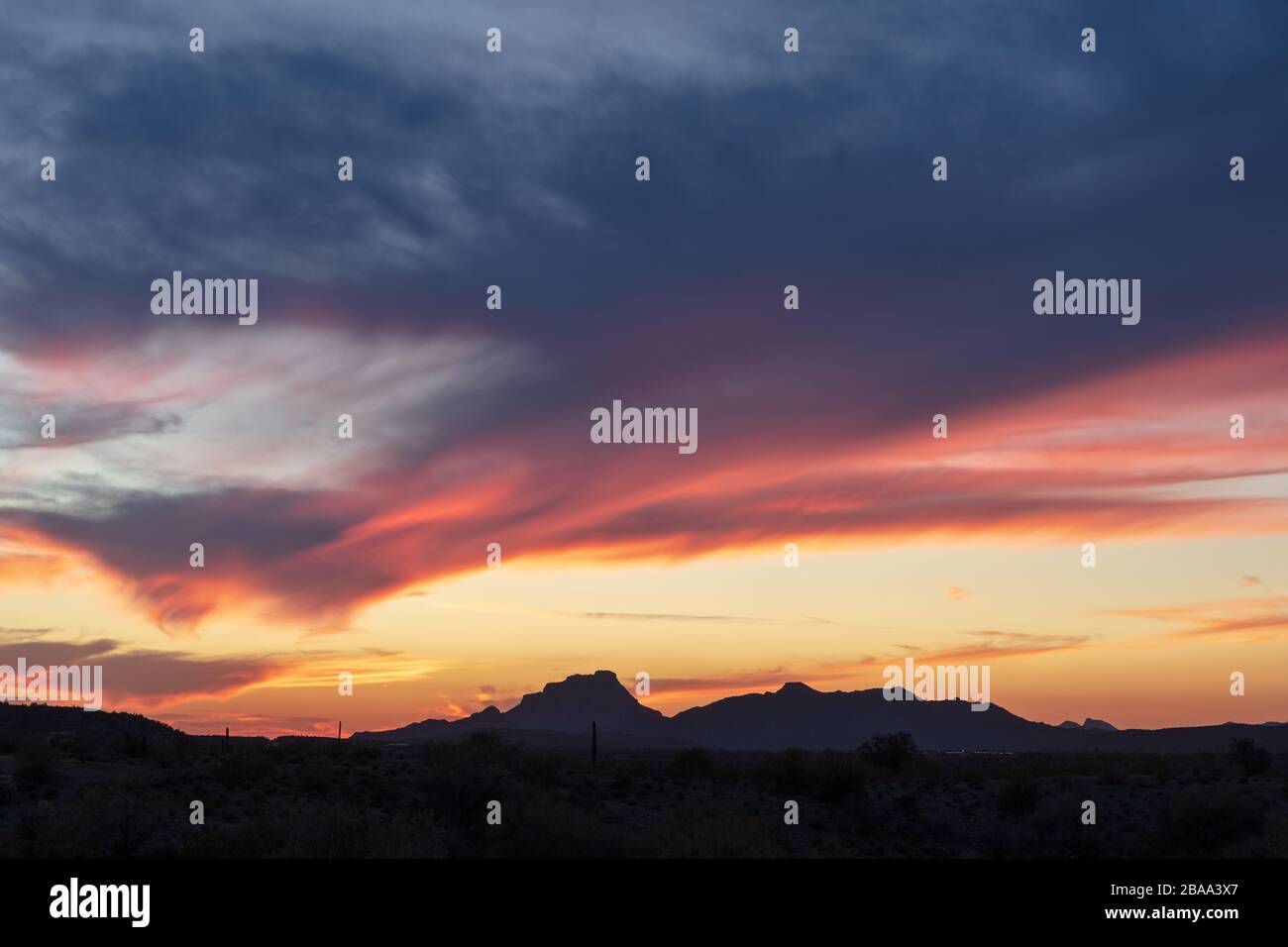 Colorful sunset sky and mountain silhouette in the desert near Phoenix, Arizona Stock Photo
