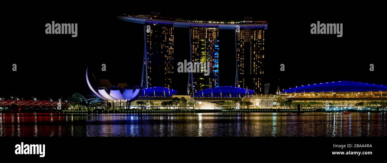 Marina Bay Sands complex and hotel lit up at night, black sky, Singapore, illuminated bright lights Stock Photo