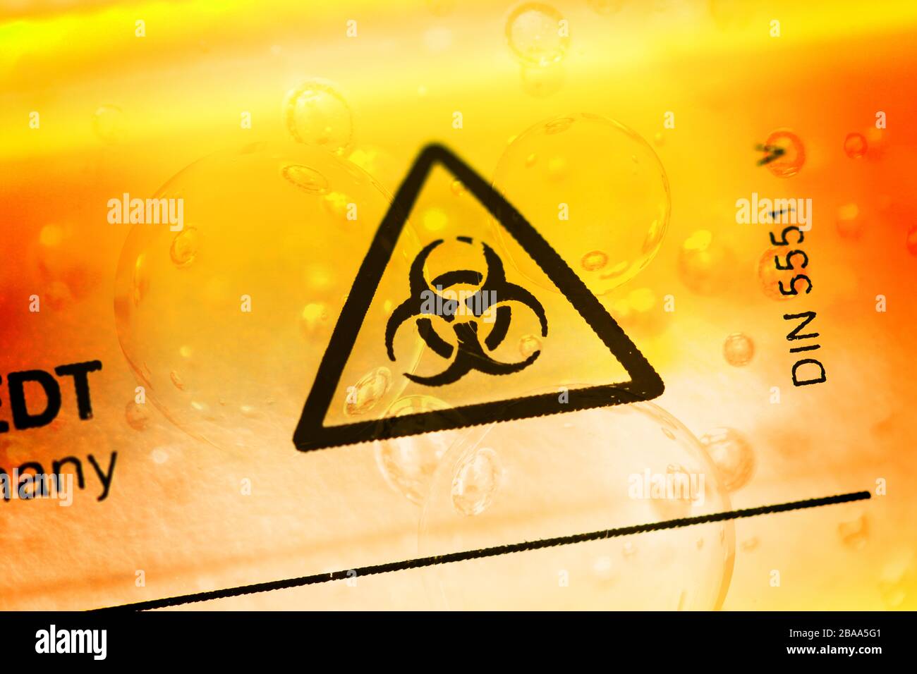 Biology danger signs on a deduction tube, symbolic photo Coronavirus, Biogefährdungszeichen auf einem Abstrich-Röhrchen, Symbolfoto Coronavirus Stock Photo