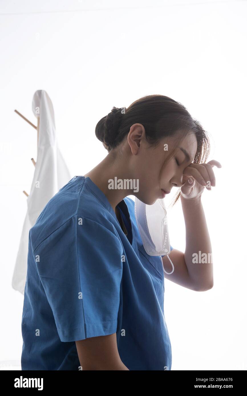 Female office worker rubbing hi-res stock photography and images - Alamy