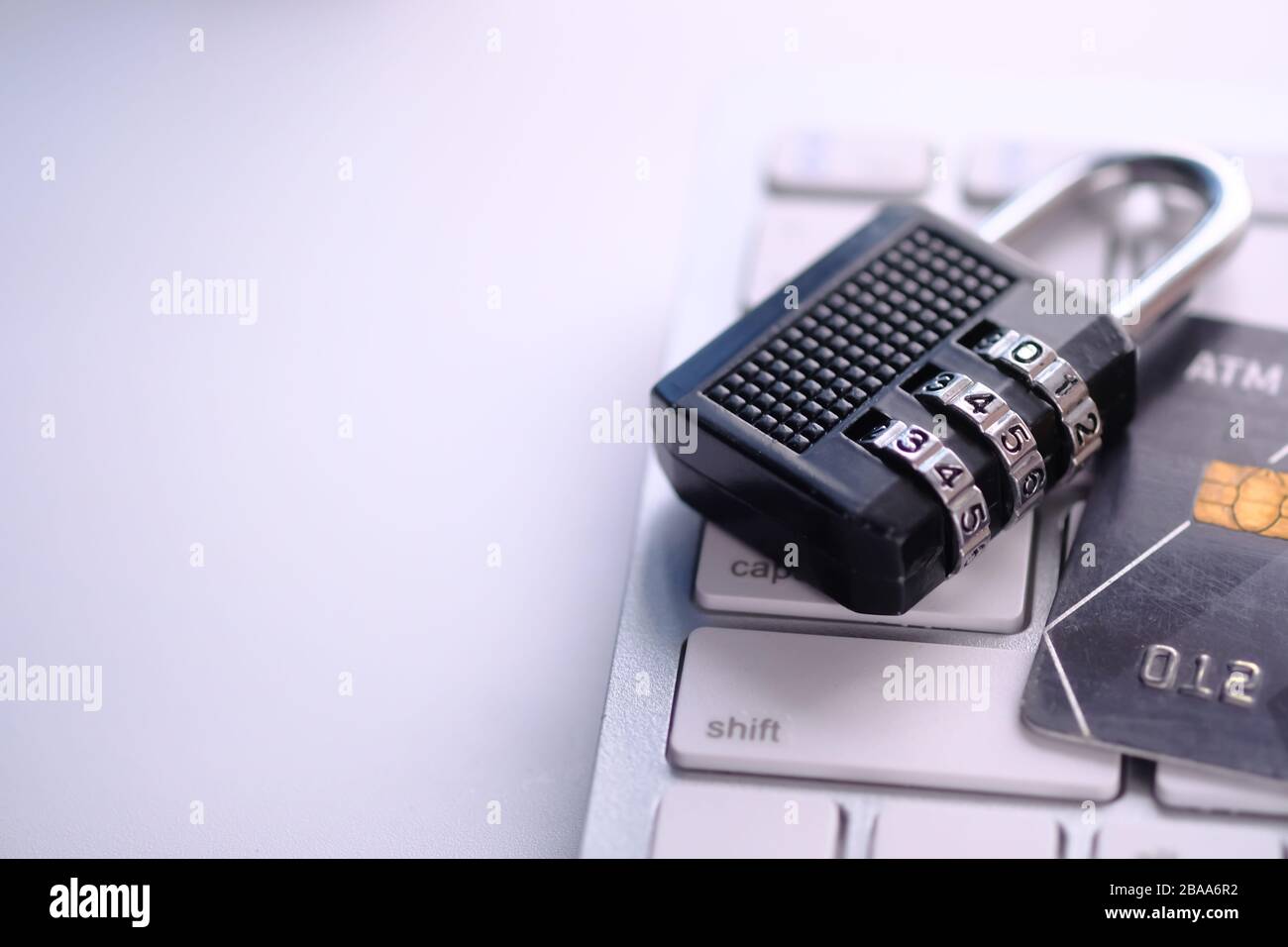 Cyber safety concept, locked, credit card and key on laptop computer