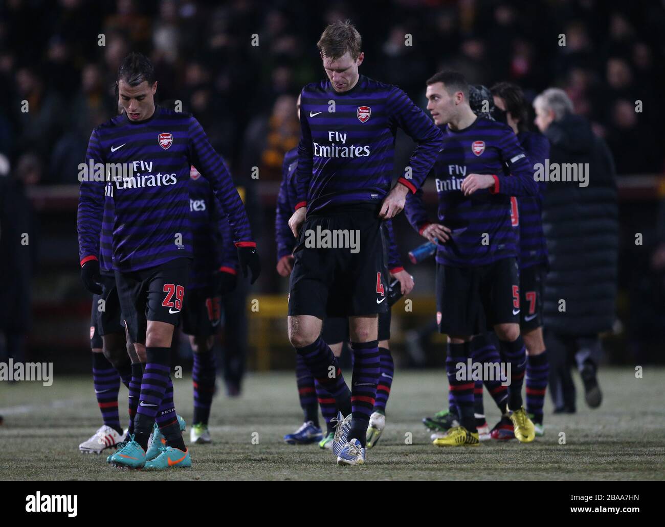 Arsenal's Marouane Chamakh (left) and Per Mertesacker appear dejected Stock Photo