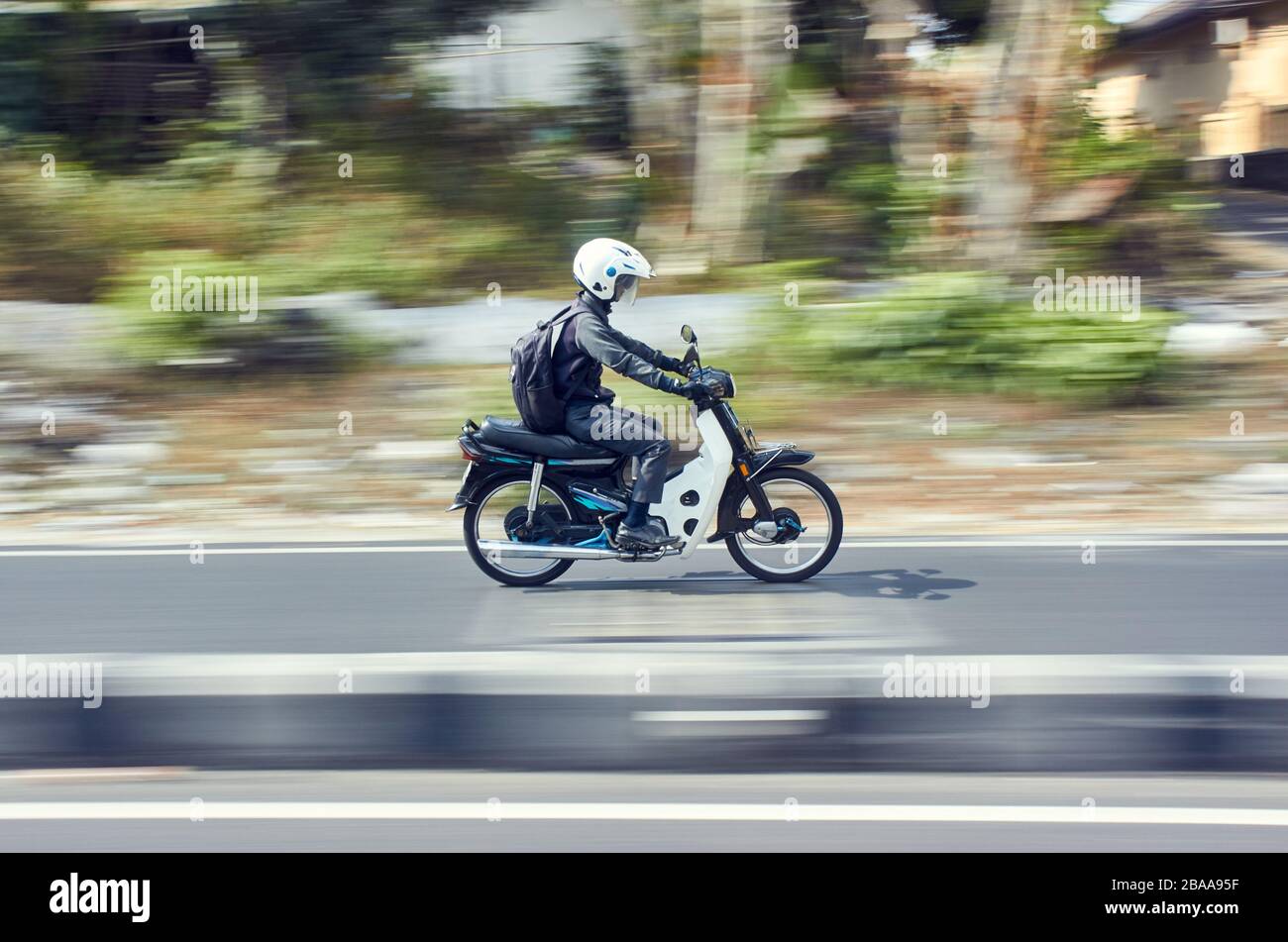Fast moving moped with panning technique Stock Photo Alamy