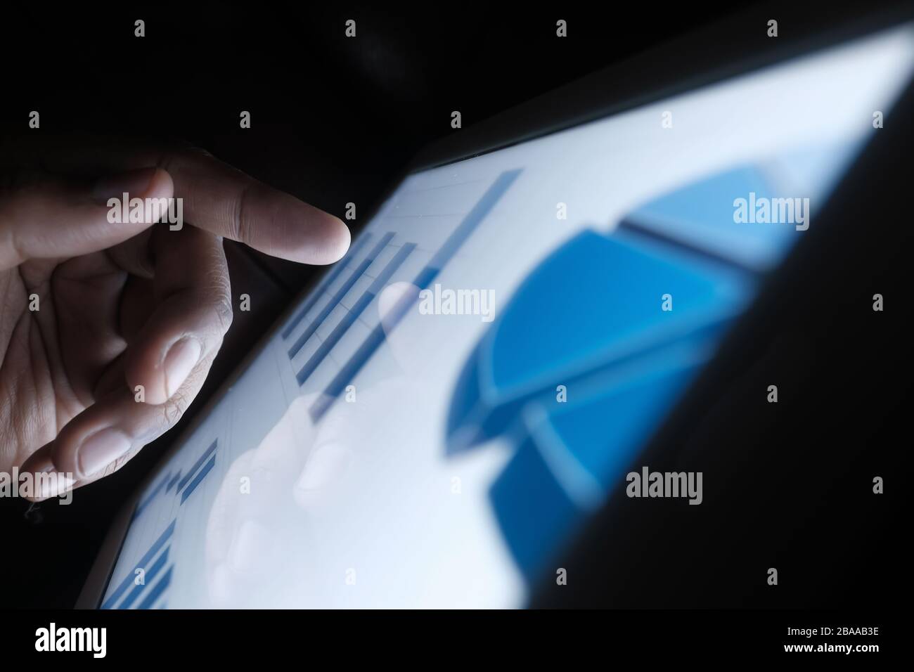 Close up of man hand analyzing chart on digital tablet Stock Photo - Alamy