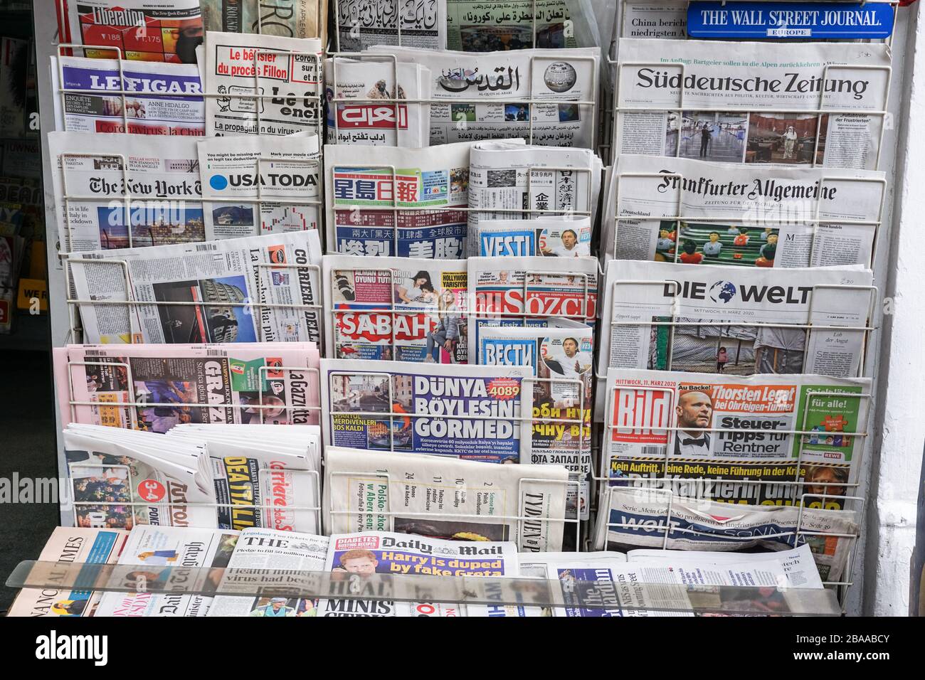 Rack with British and international newspapers outside newsagent's shop in London, UK Stock Photo