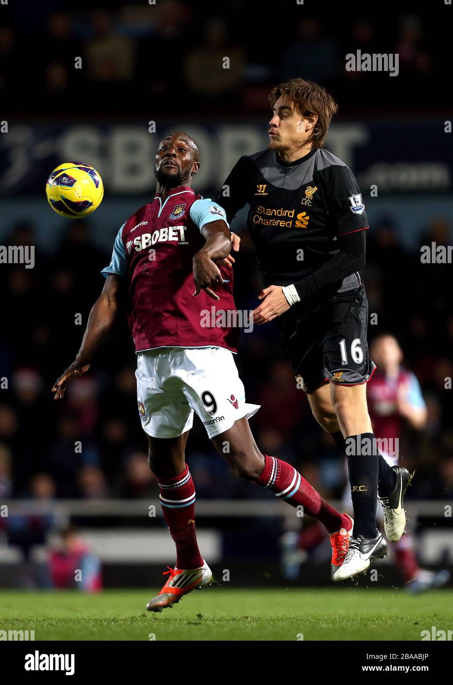 West Ham United's Carlton Cole and Liverpool's Sebastian Coates (right) battle for the ball Stock Photo