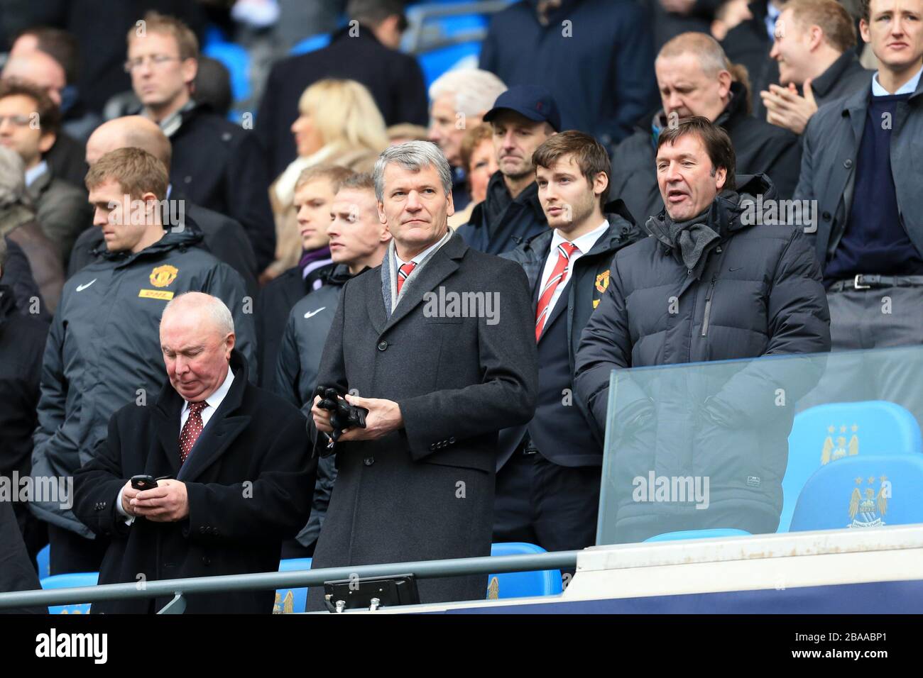 Manchester United chief executive David Gill (centre) and Manchester United secretary John Alexander (r) in the stands at the Etihad Stadium Stock Photo