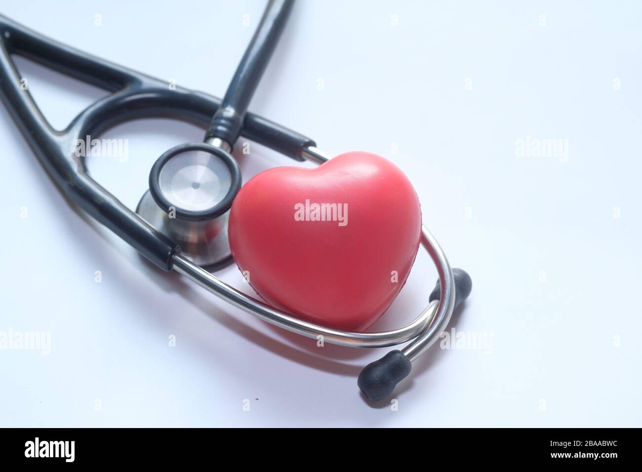 Stethoscope and heart on white background, top view Stock Photo - Alamy