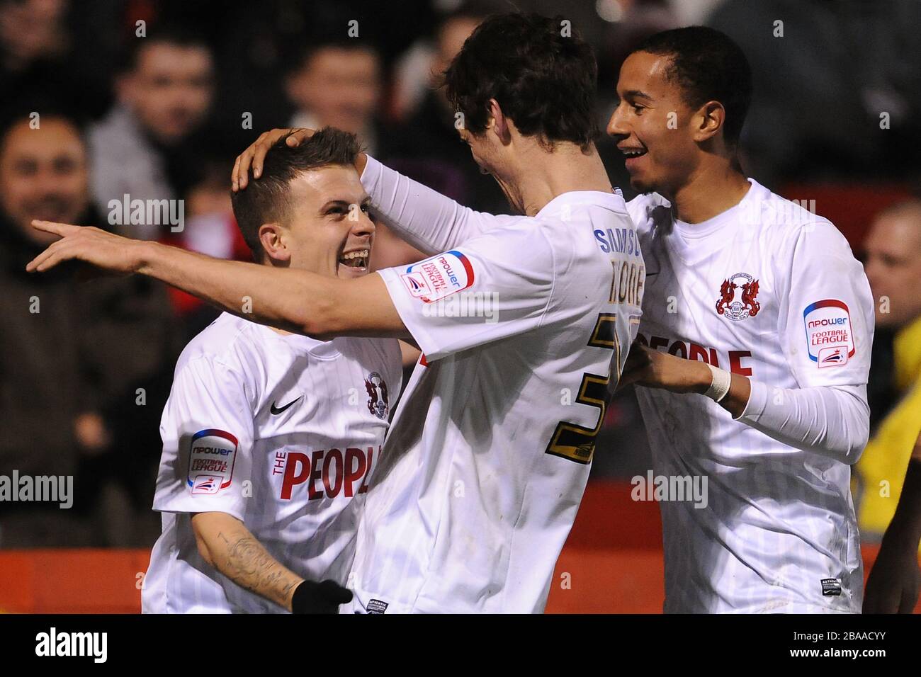 Leyton Orient's Dean Cox (left) celebrates scoring his teams fourth goal of the game with teammate David Mooney (centre) Stock Photo