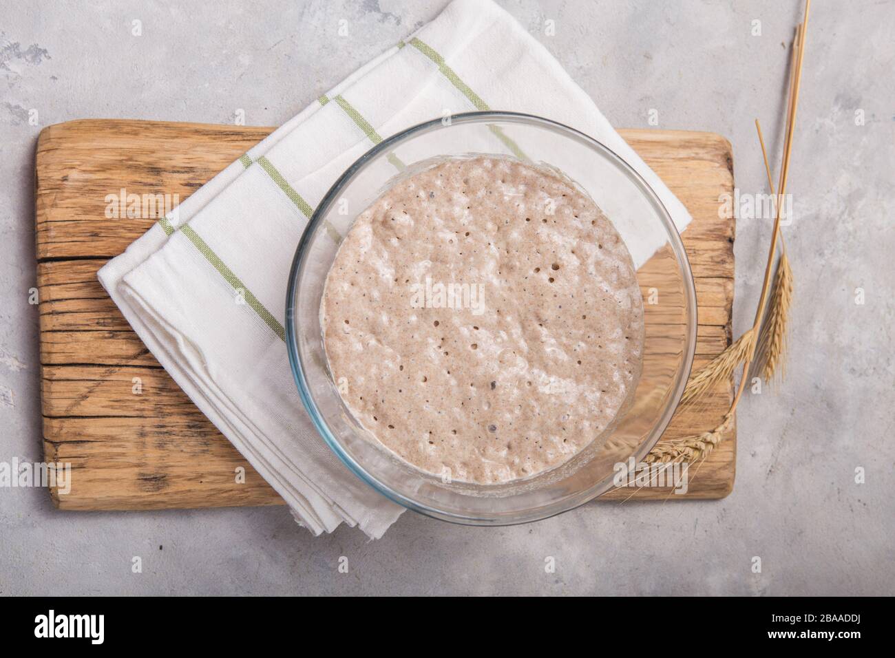 Mixing together ingredients of hot-water crust pastry dough, using wooden  spoon Stock Photo - Alamy