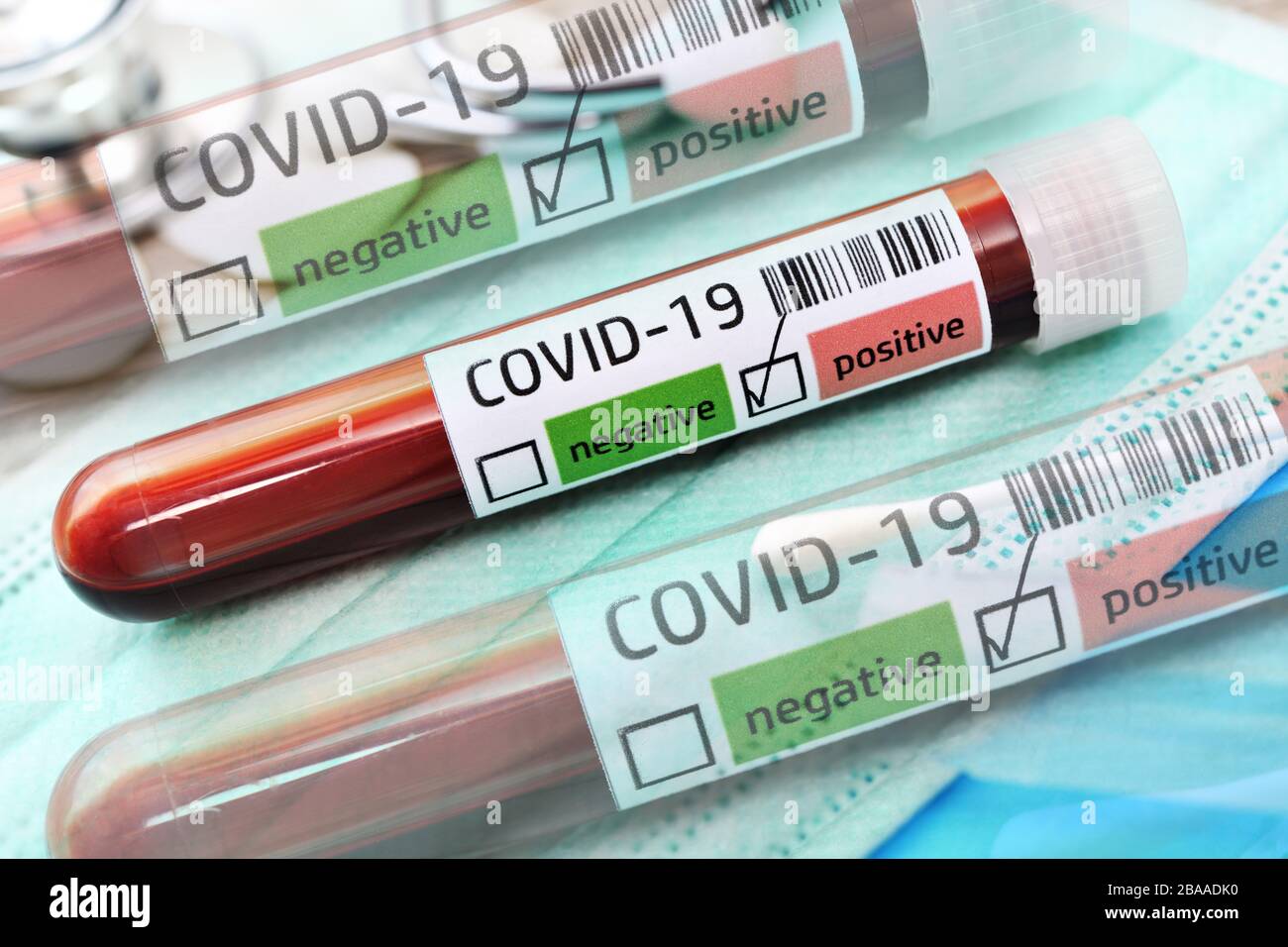 PHOTOMONTAGE, blood tests with positive Covid 19 findings, symbolic photo Coronavirus, FOTOMONTAGE, Blutproben mit positivem Covid-19-Befund, Symbolfo Stock Photo
