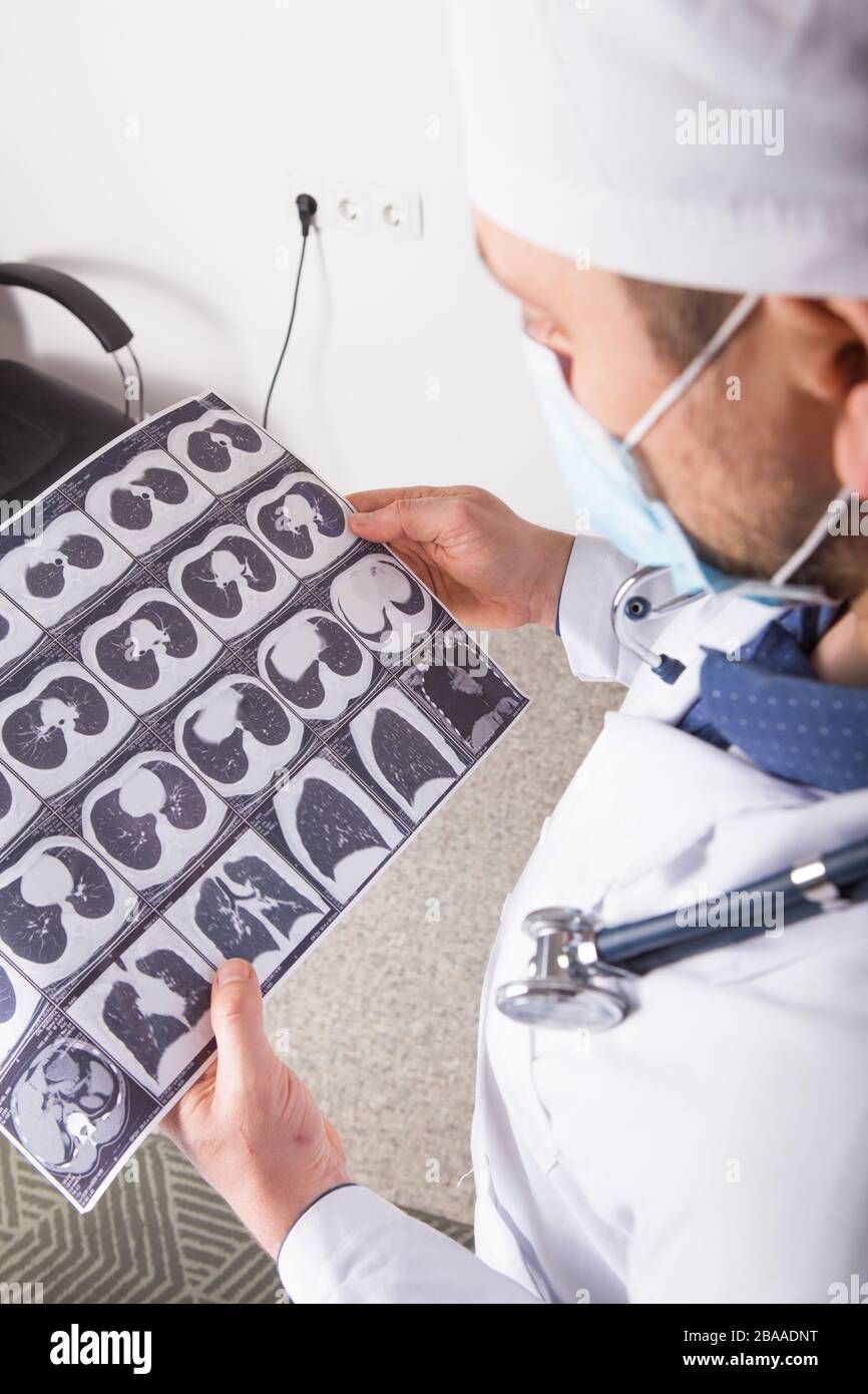 Doctor at appointment inspects and examines ct scan of chest and