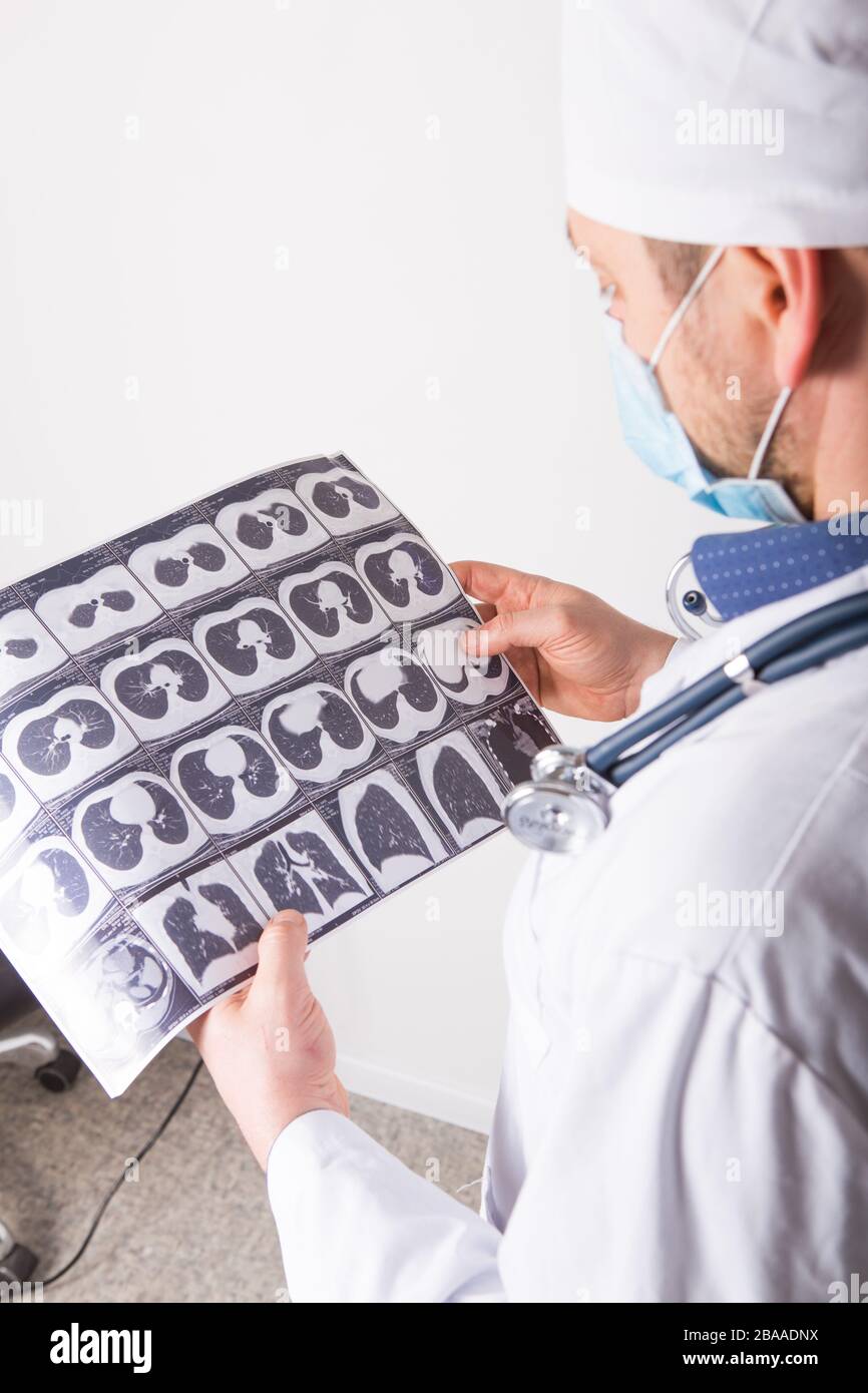 Doctor at appointment inspects and examines ct scan of chest and