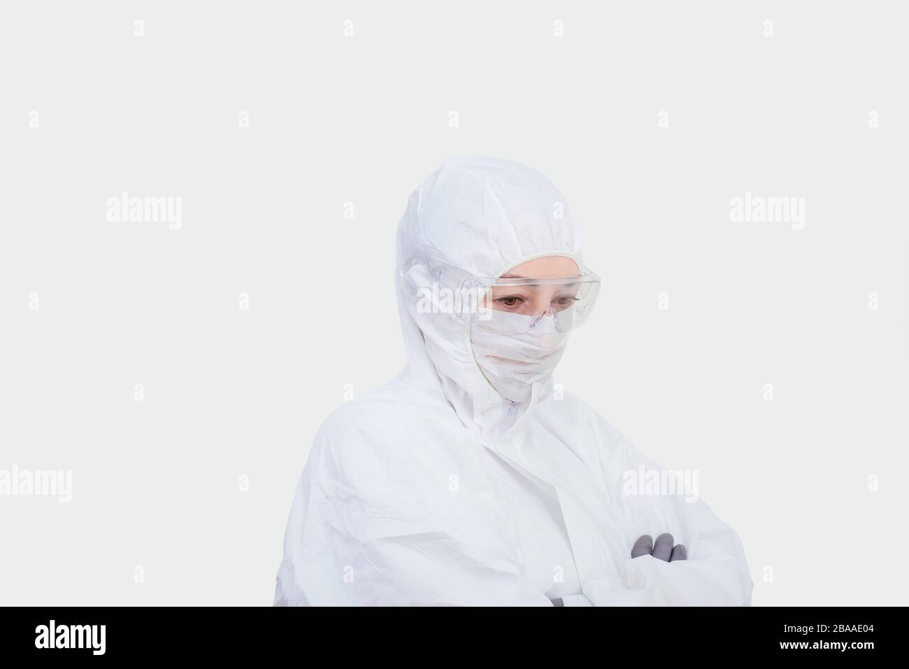 Female doctor in protective suit, glasses and face mask. Paramedic ...