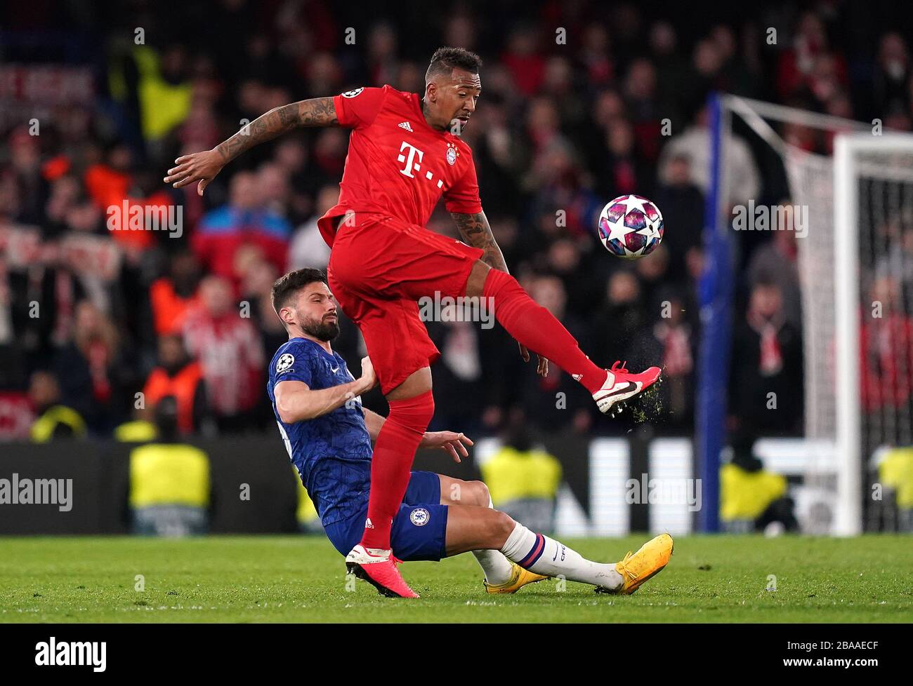 Chelsea's Olivier Giroud (left) and Bayern Munich's Jerome Boateng battle for the ball Stock Photo