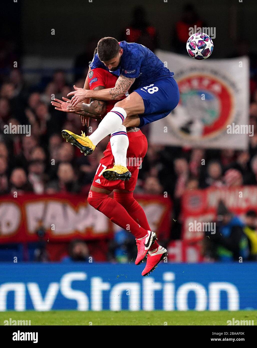 Bayern Munich's Jerome Boateng (left) and Chelsea's Olivier Giroud compete for a header Stock Photo