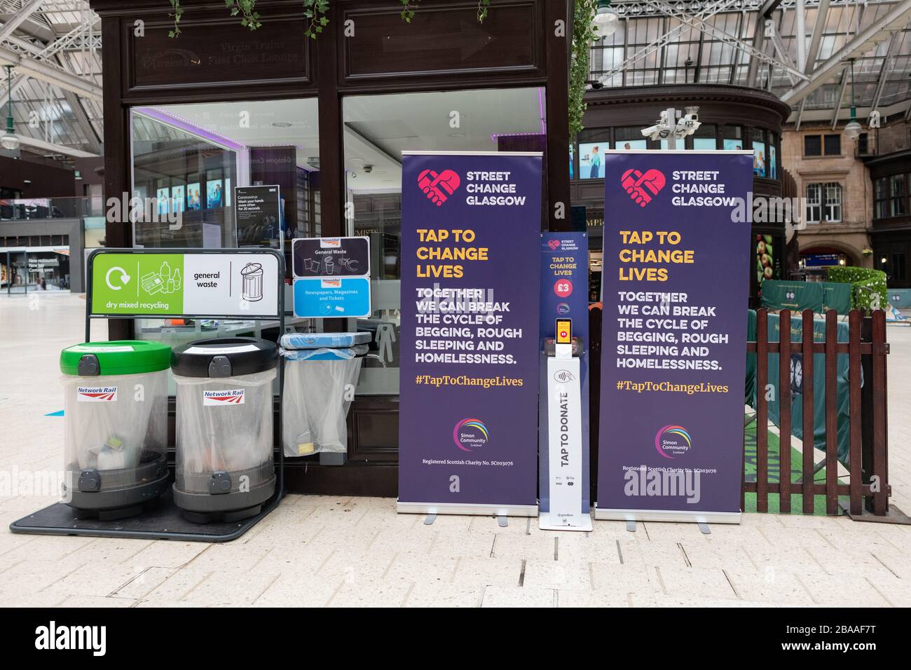 'Street Change Glasgow' point at Central Station - an alternative way to donate to people experiencing homelessness and begging across Glasgow Stock Photo