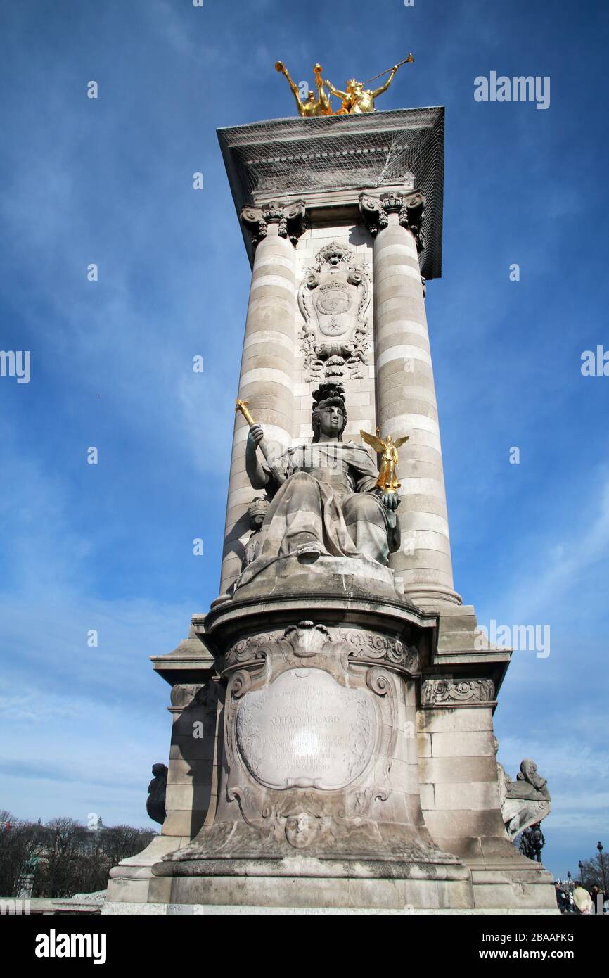 Column at the end of the Pont Alexandre III (Alexander III Bridge) on the River Seine, Paris, France Stock Photo