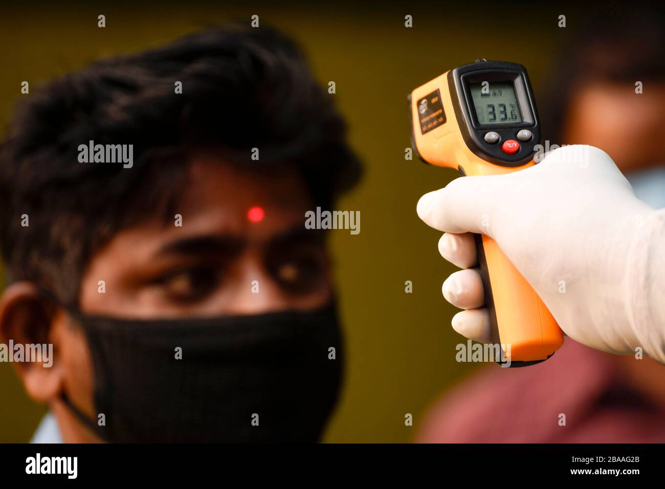 Guwahati, Assam, India. 26th Mar, 2020. Corona Virus emergency in Assam. Guwahati, Assam, India. 26 March 2020. Police personnel thermal screening before entering to the Governor House of Assam, in Guwahati on 26 March, 2020. PHOTO: DAVID TALUKDAR Alamy Live News Credit: David Talukdar/Alamy Live News Stock Photo