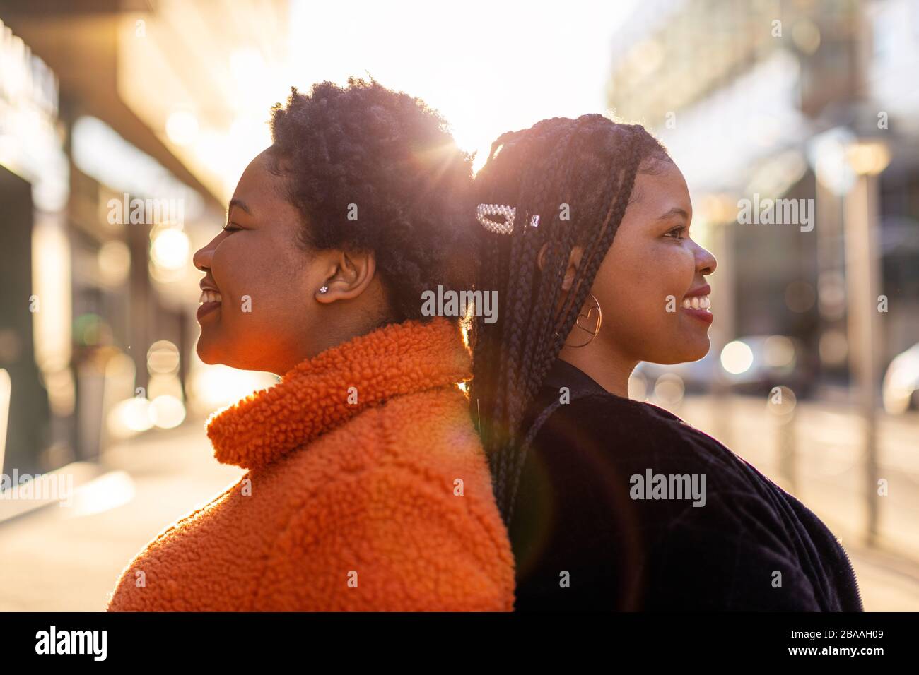 Two beautiful Afro american women in an urban city area Stock Photo
