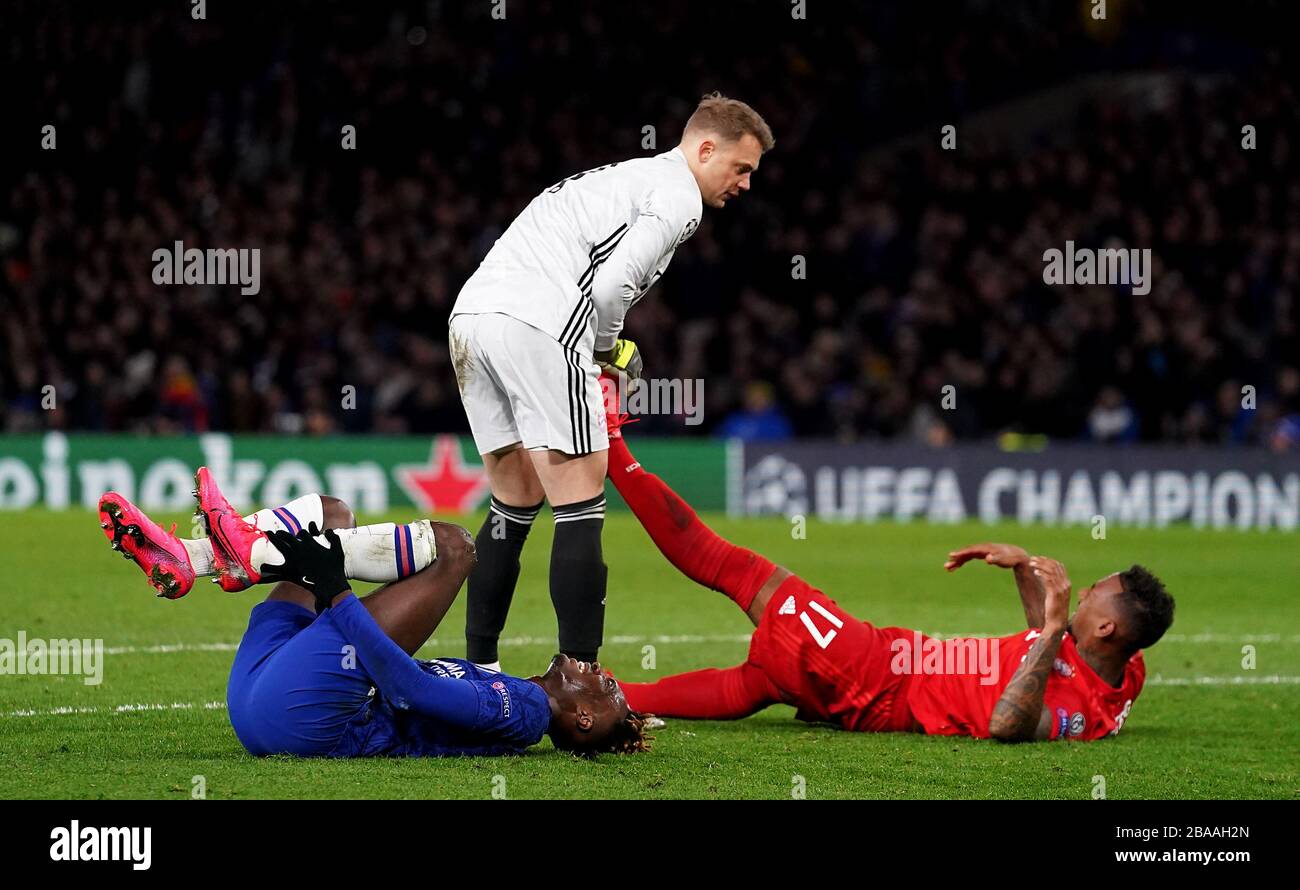 Chelsea's Tammy Abraham (left) and Bayern Munich's Jerome Boateng lie on the floor injuried Stock Photo