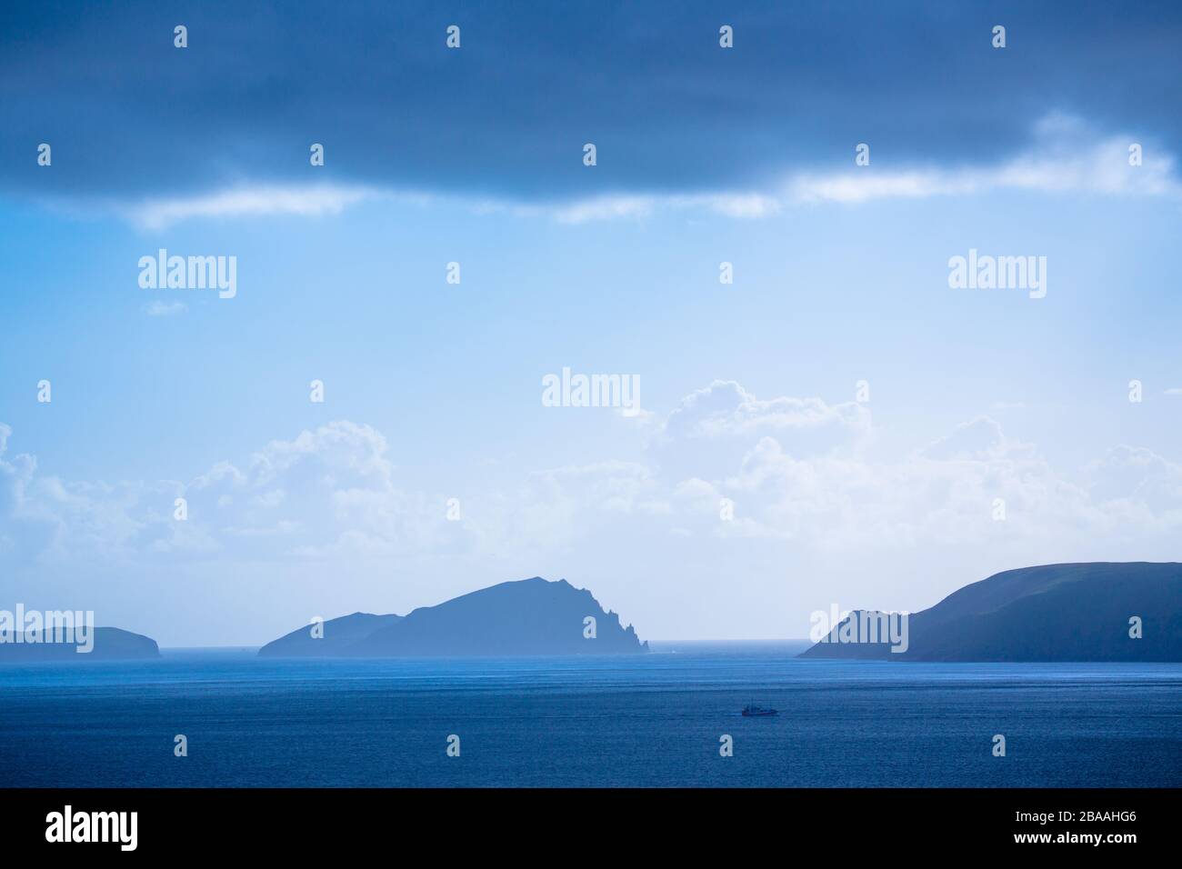 Islands sit beautifully on a calm blue sea, Ireland Stock Photo