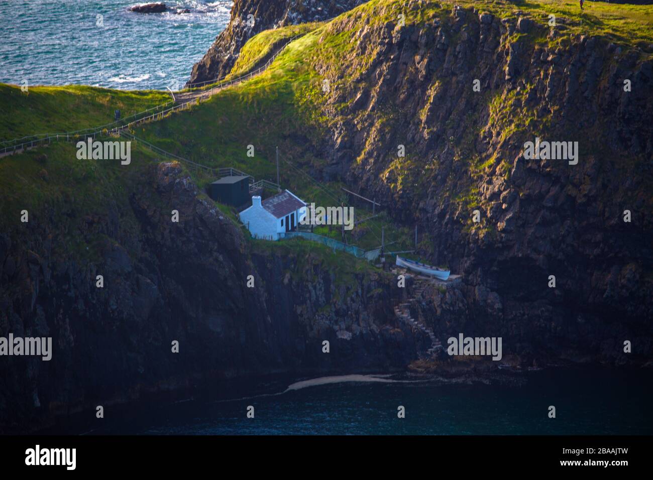 The National trust house at the end of the walk bridge, Carrick a rede island, Northern Island Stock Photo
