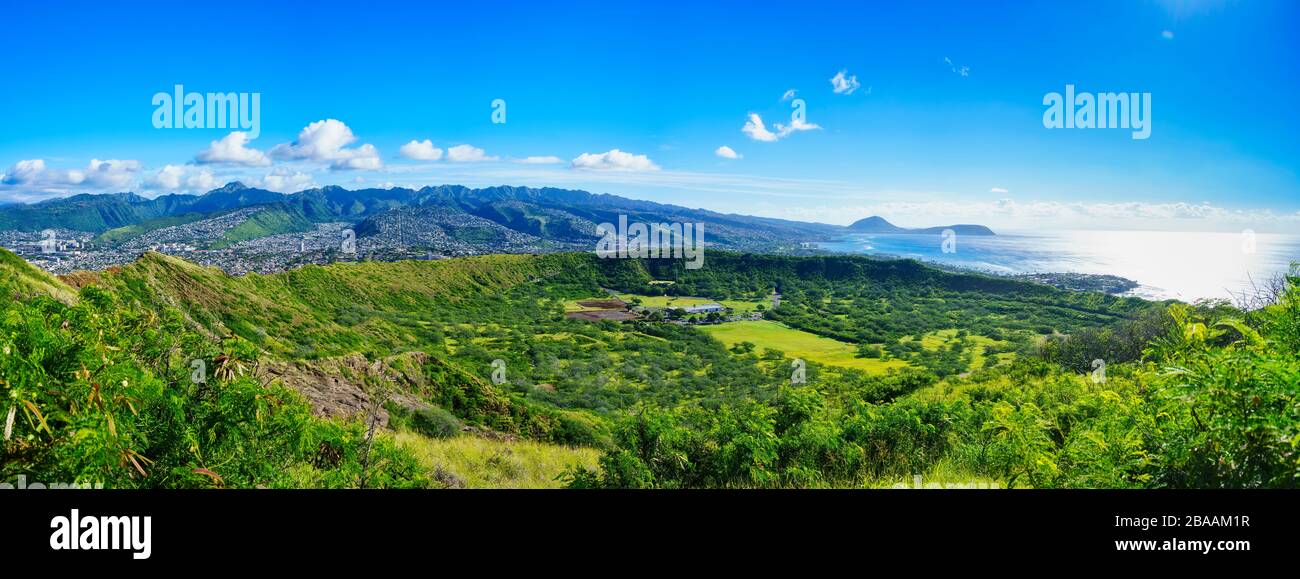 Panorama of inside of Diamond Head Crater from summit with Koko Head and Kahala distant on island of Oahu, USA Stock Photo