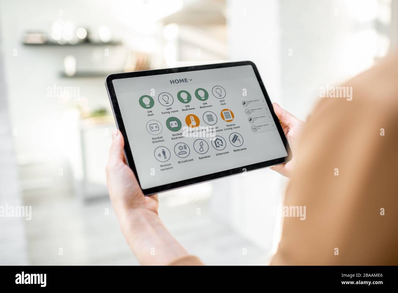 Controlling smart home devices using a digital tablet with launched ...