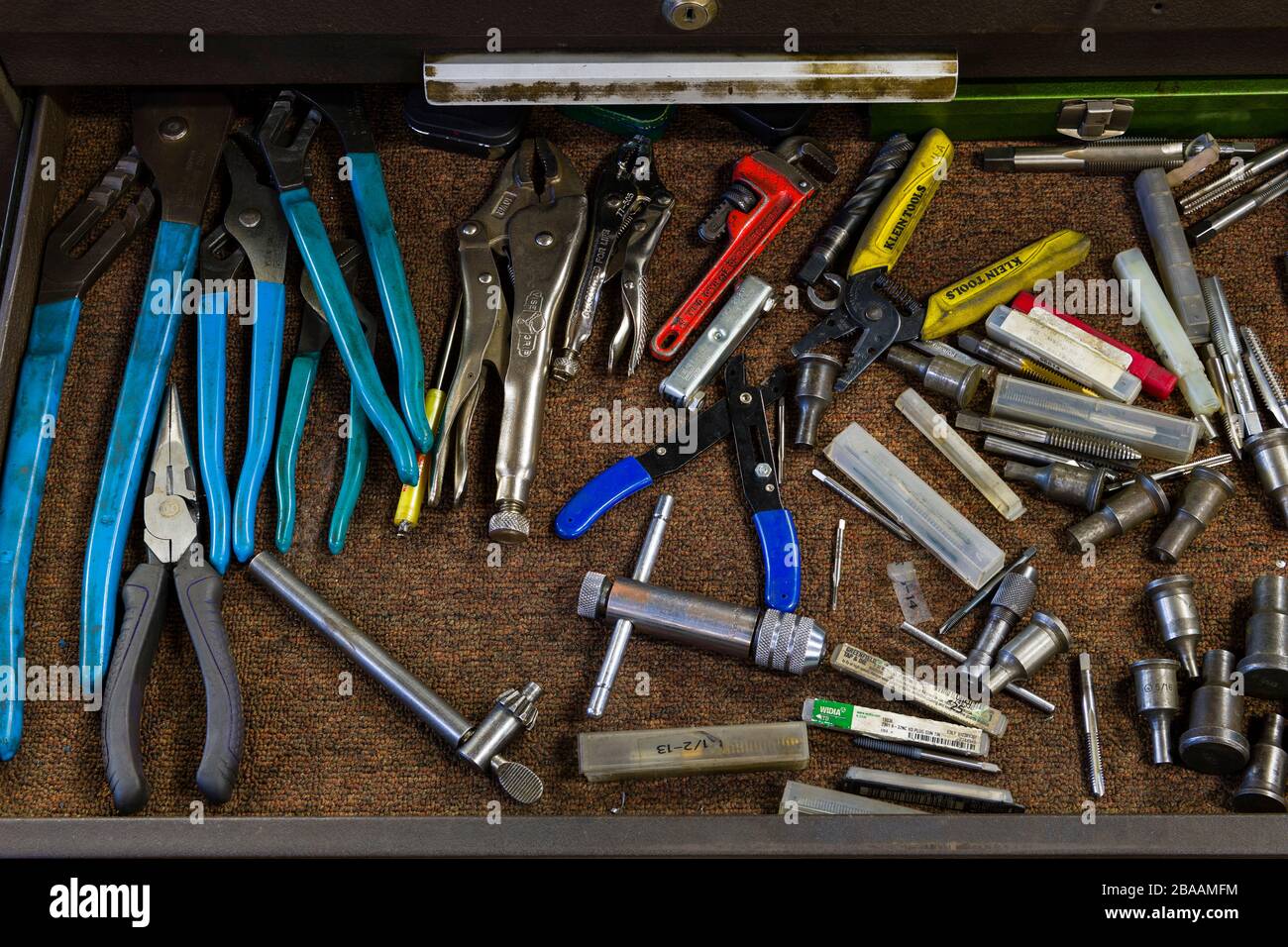 An open toolbox drawer filled with various handtools Stock Photo