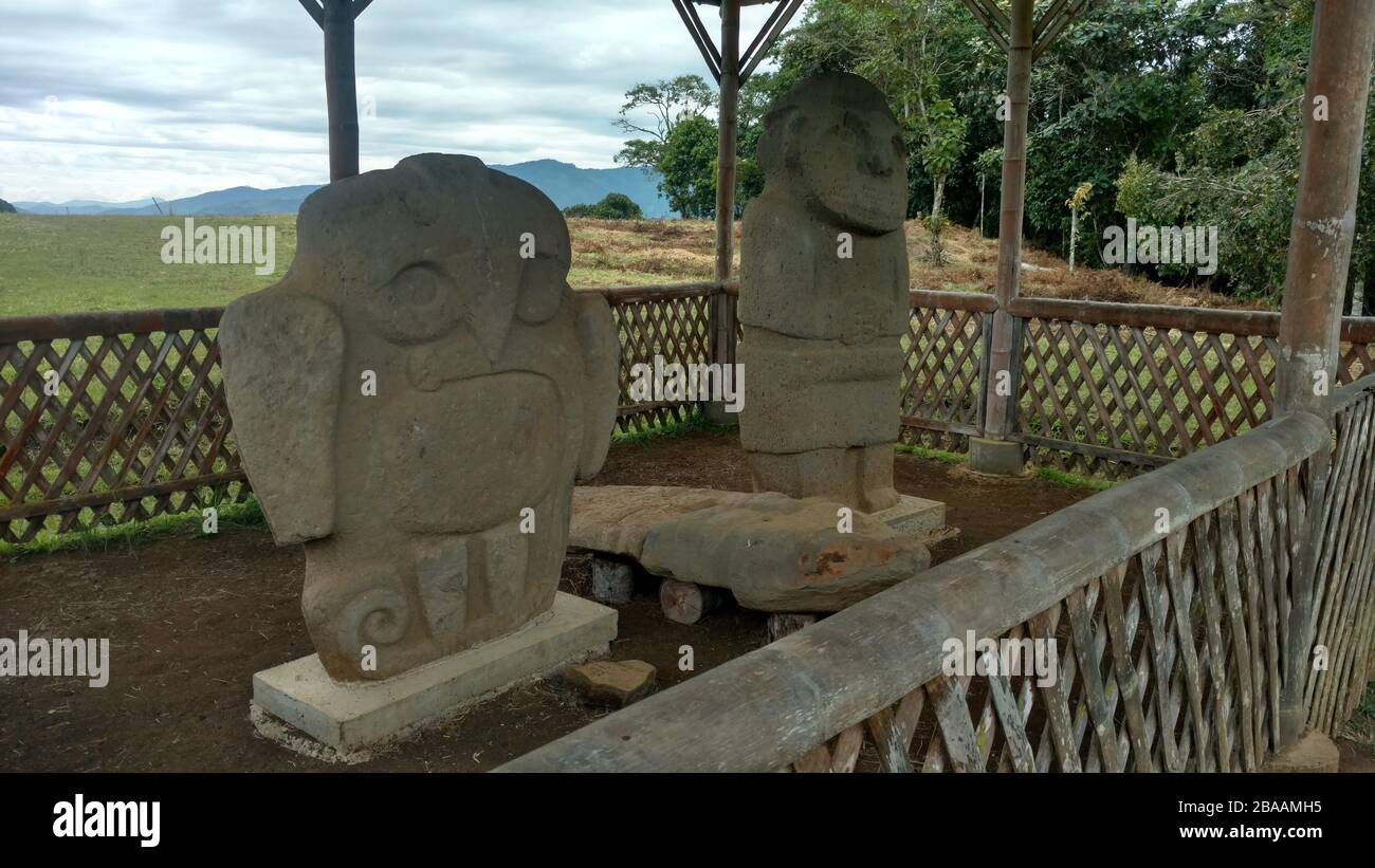 Statues in The San Agustín Archaeological Park surrounded by greenery ...