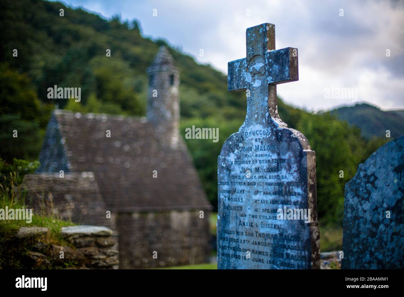 A tombstone in the shape of cross in an ancient cemetery in the Republic of Ireland, Ireland Stock Photo