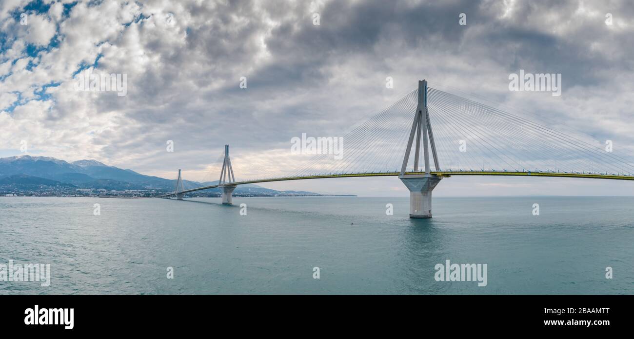 Aerial view of long cablestayed Rio bridge in Greece at clouds weather