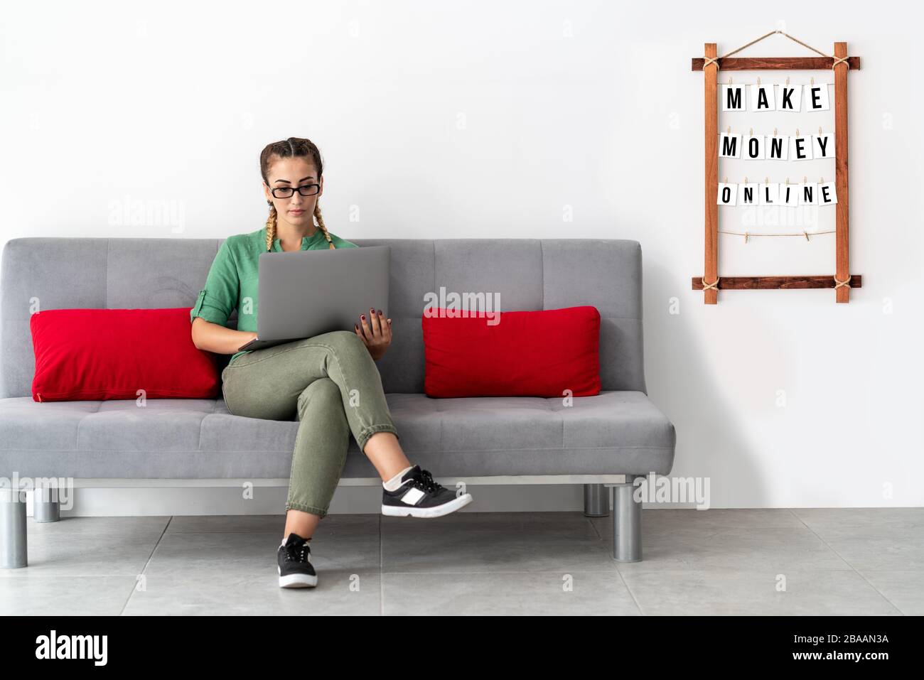 Young woman is working at home, with professinal equipment. isolation from global threat Stock Photo