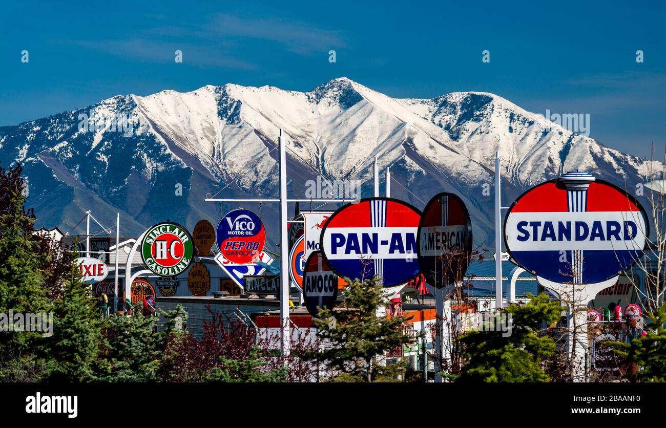 Gas station signs and snowcapped Buckley Mountain, Provo, Utah, USA Stock Photo