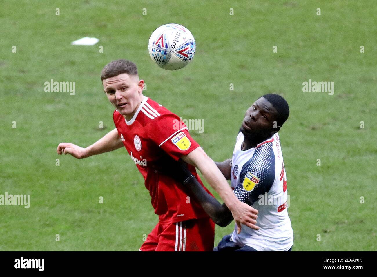 Bolton Wanderers' Yoan Zouma (right) and Accrington Stanley's Colby Bishop battle for the ball Stock Photo