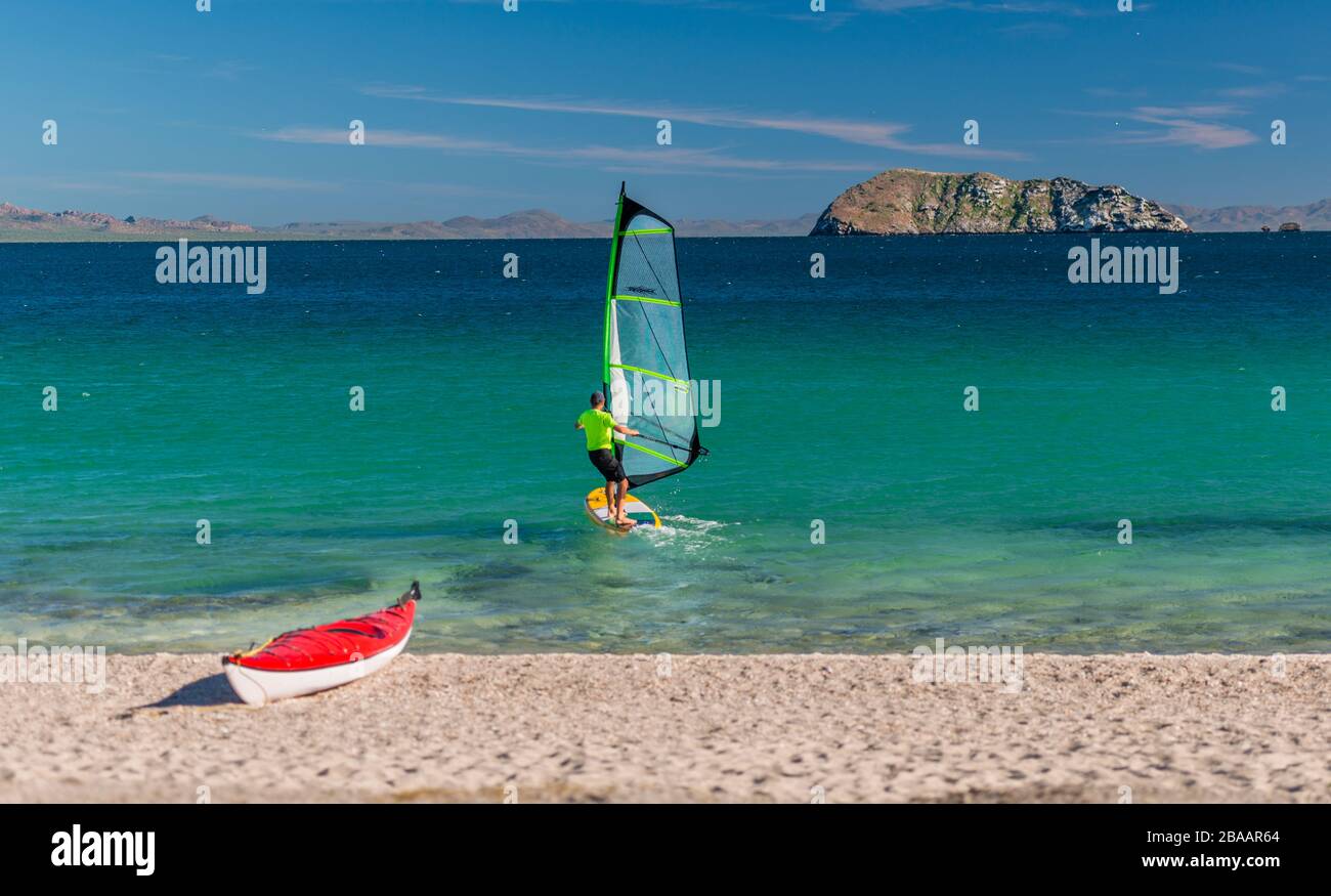View of wind surfer and kayak on beach Sea of Cortez, Baja California Sur, Mexico Stock Photo
