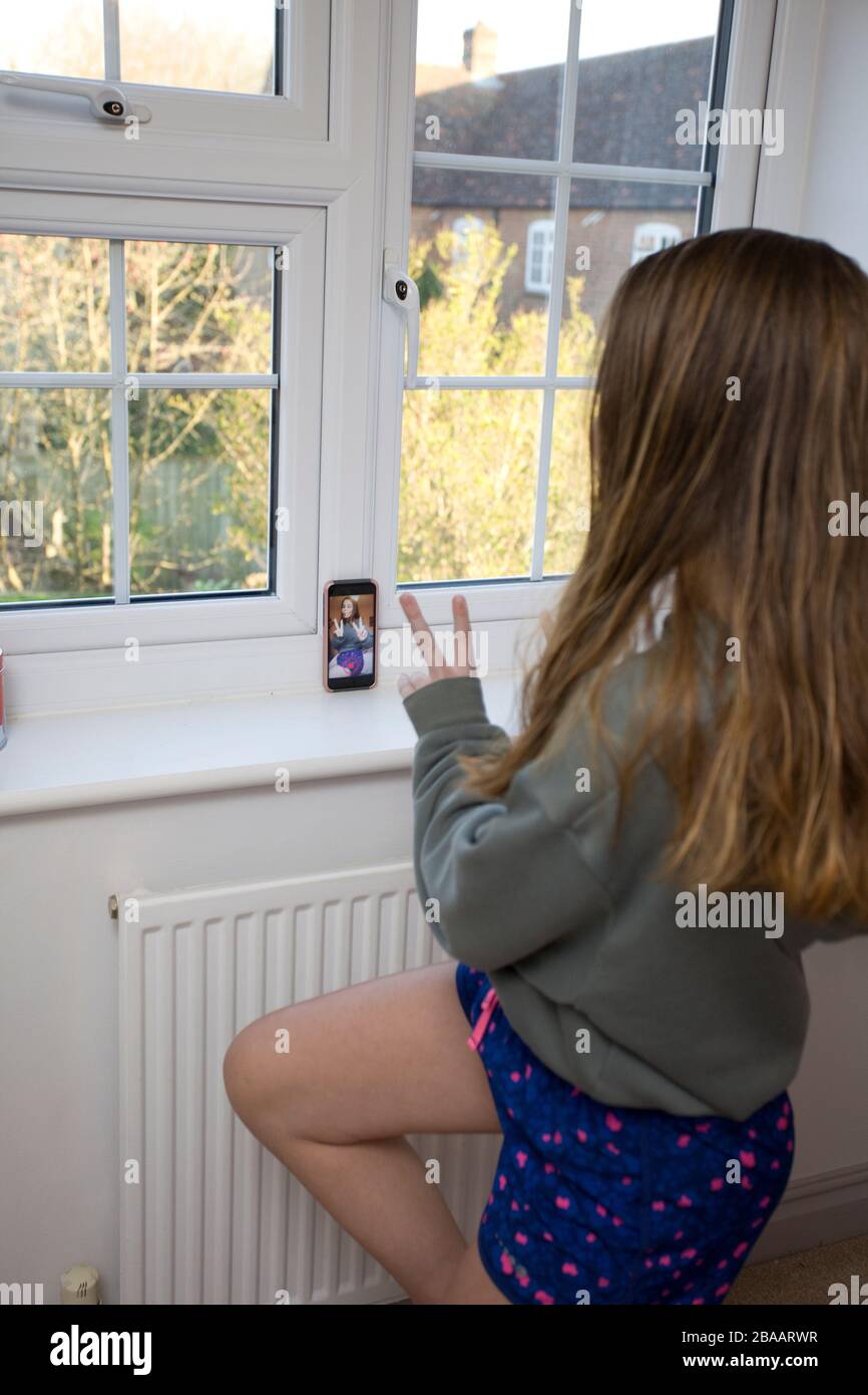 young girl filming herself dancing on TikTok Stock Photo
