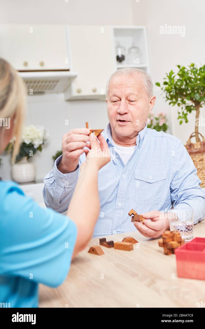 Nursing care for senior citizens with dementia at home when nursing Stock Photo