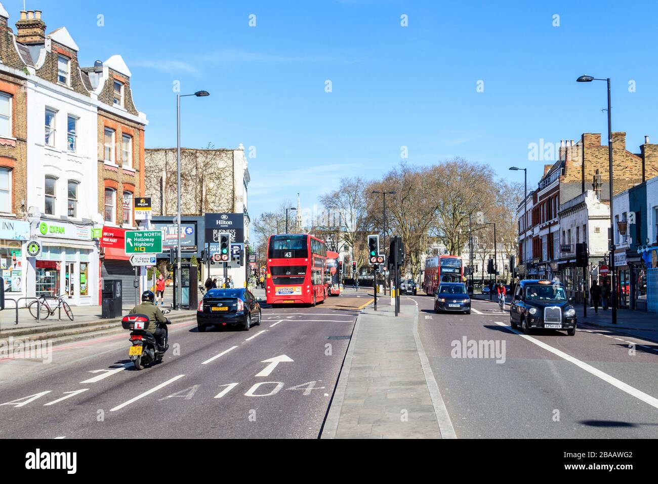 Islington High Street, unusually quiet as shops close and people stay at home at the onset of the coronavirus pandemic, London, UK Stock Photo