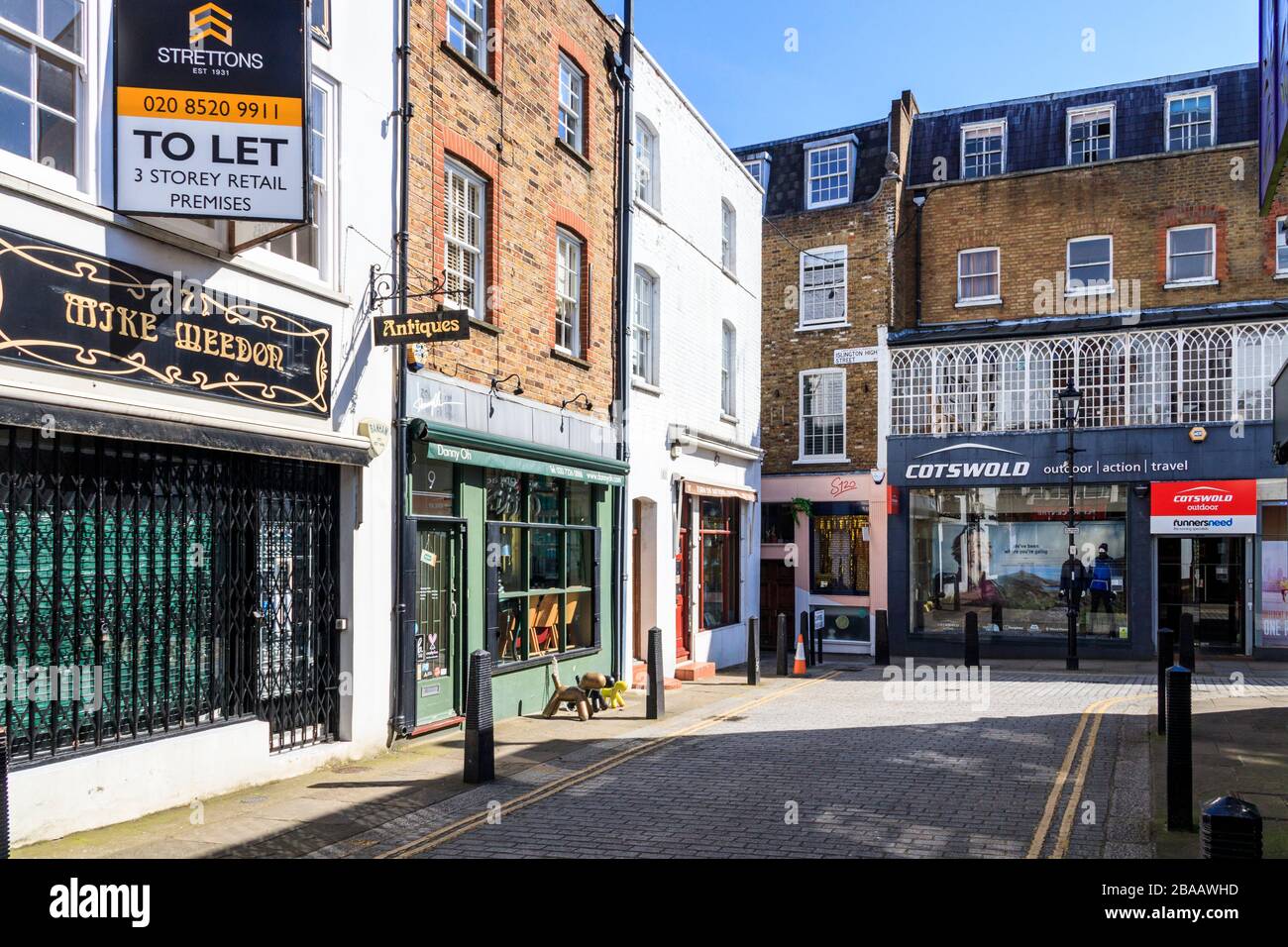 Cotswold outdoor supplies shop in Camden Passage, Islington, as shops begin to close the day before the coronavirus lockdown restrictions, London, UK Stock Photo