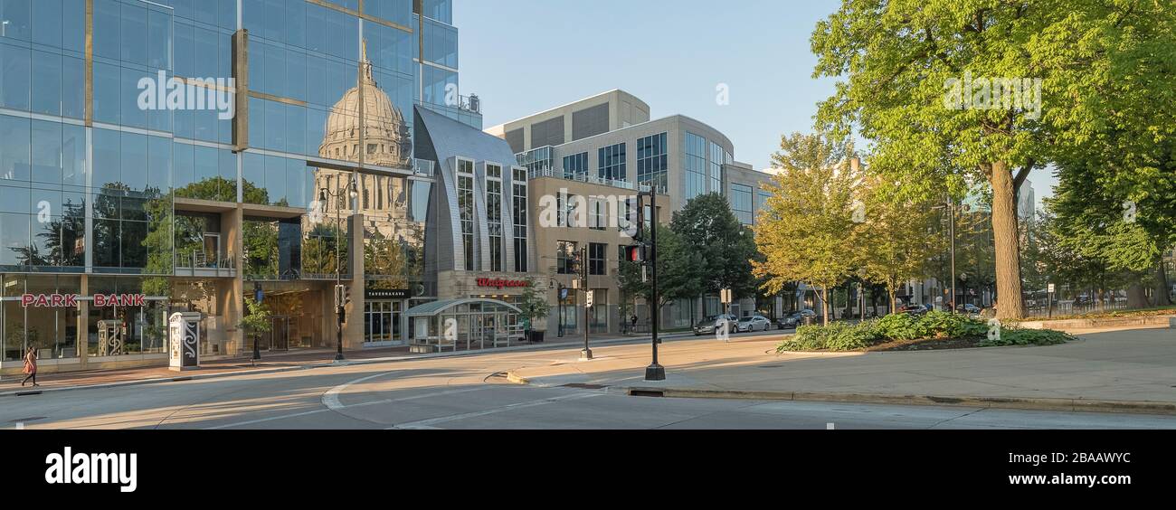 View of street and Wisconsin State Capitol reflected on glass building, Madison, Dane County, Wisconsin, USA Stock Photo