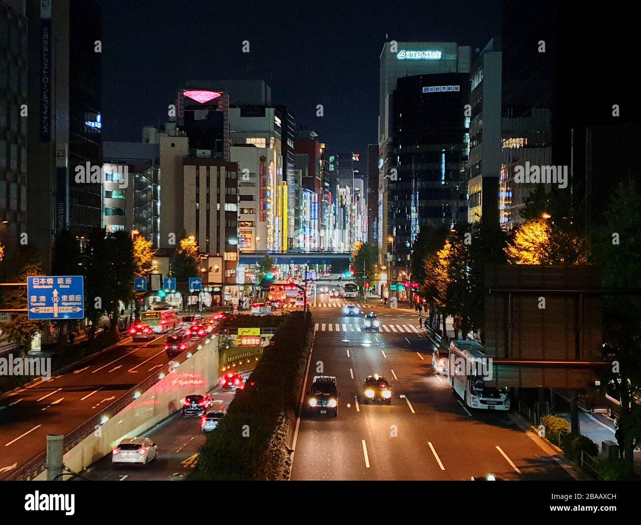 Busy traffic at night in Tokyo Stock Photo