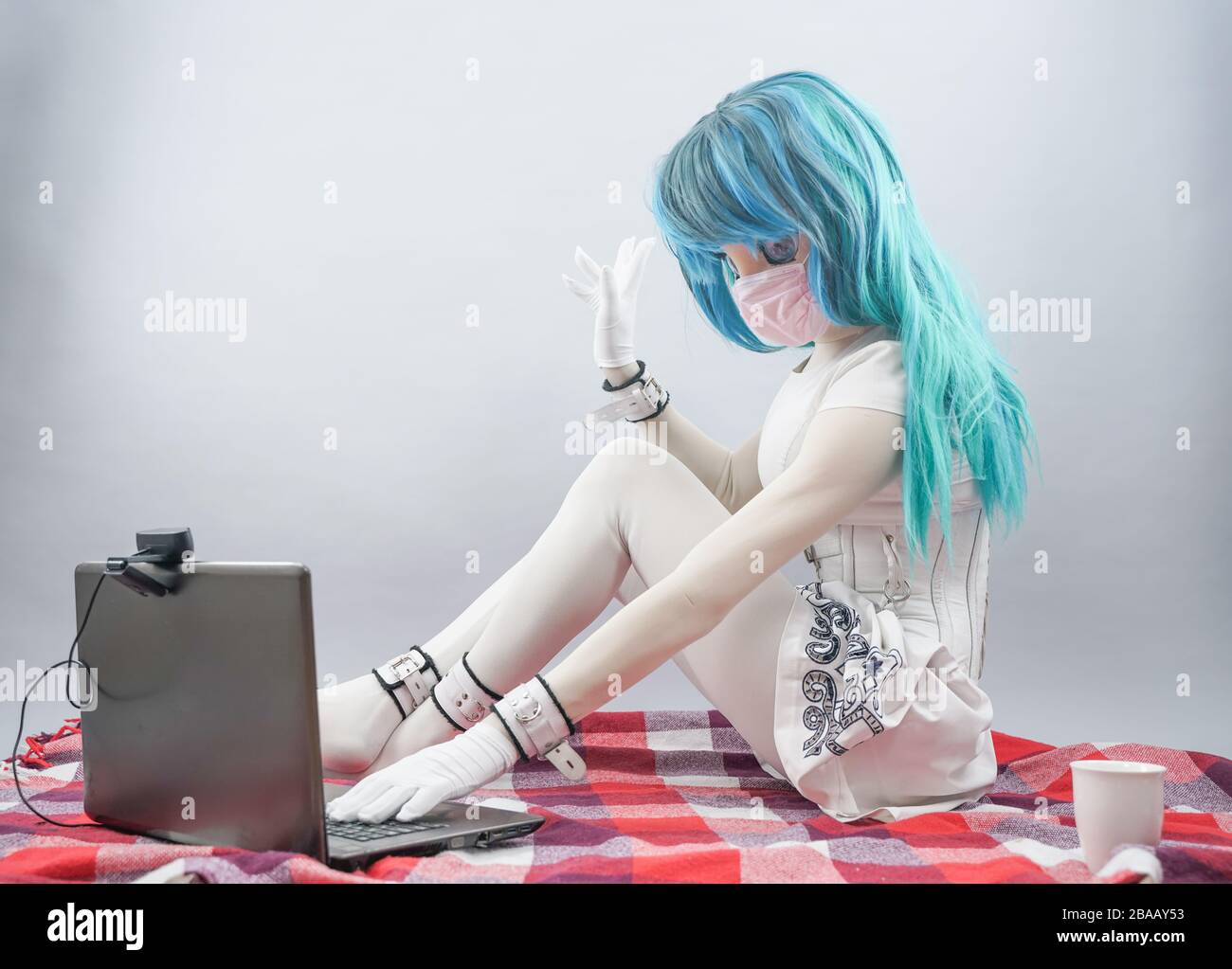 Coronavirus. Anime young woman at home sick with mask for corona virus.  Female wears masks to protect and take care of health. Home working with  compu Stock Photo - Alamy
