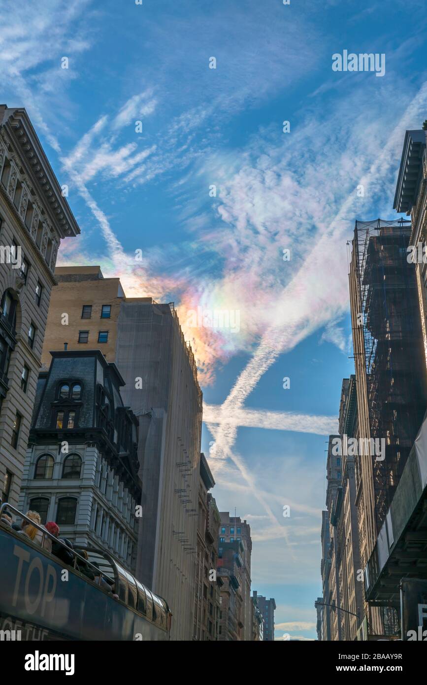 Circumhorizontal Arc Rainbow appears over the Midtown Manhattan Fifth Avenue buildings in the winter at New York City NY USA on Dec. 27 2018. Stock Photo