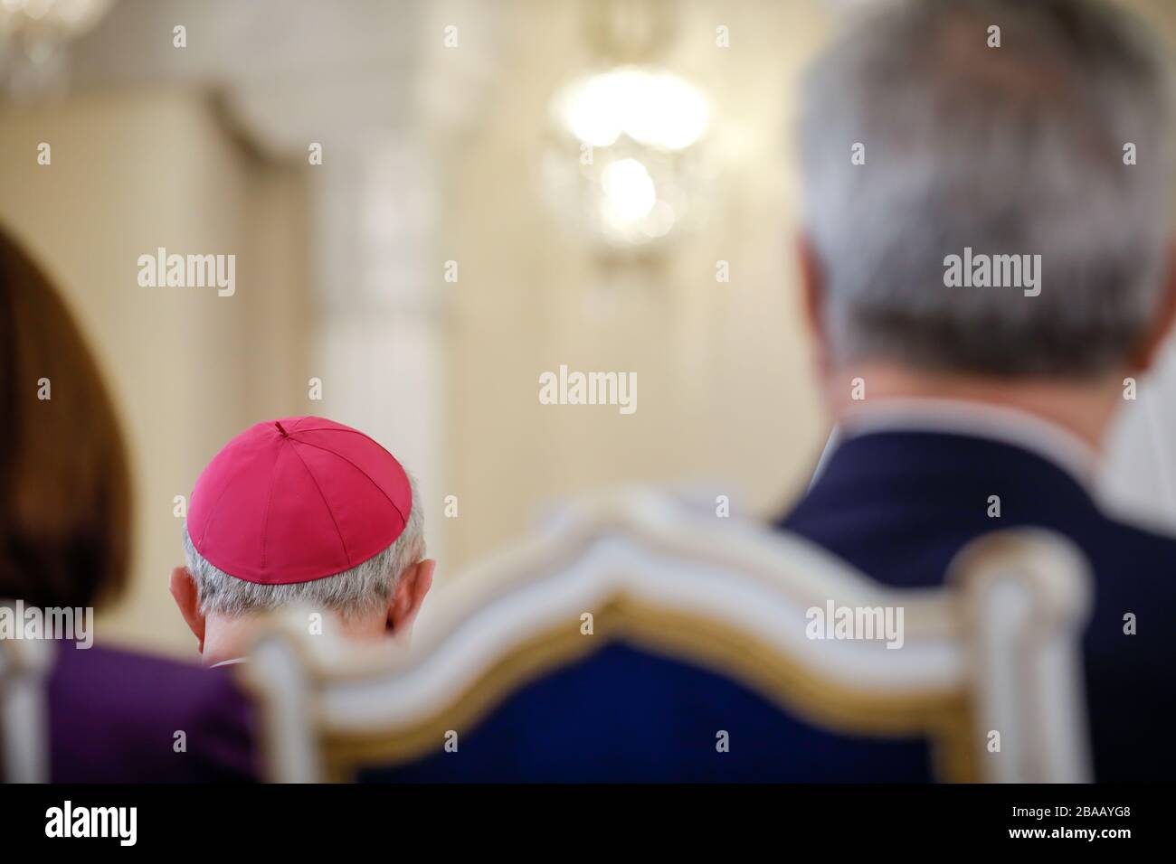 Details with a zucchetto - a small, hemispherical, form-fitting ecclesiastical skullcap worn by clerics of various Catholic churches on the head of a Stock Photo