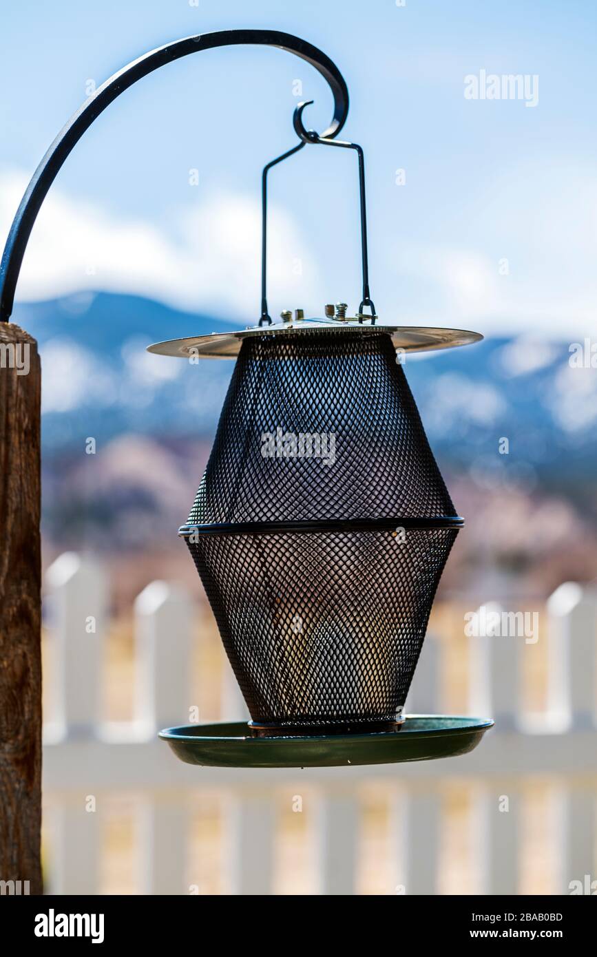 Exterior view of empty metal bird feeder Stock Photo Alamy