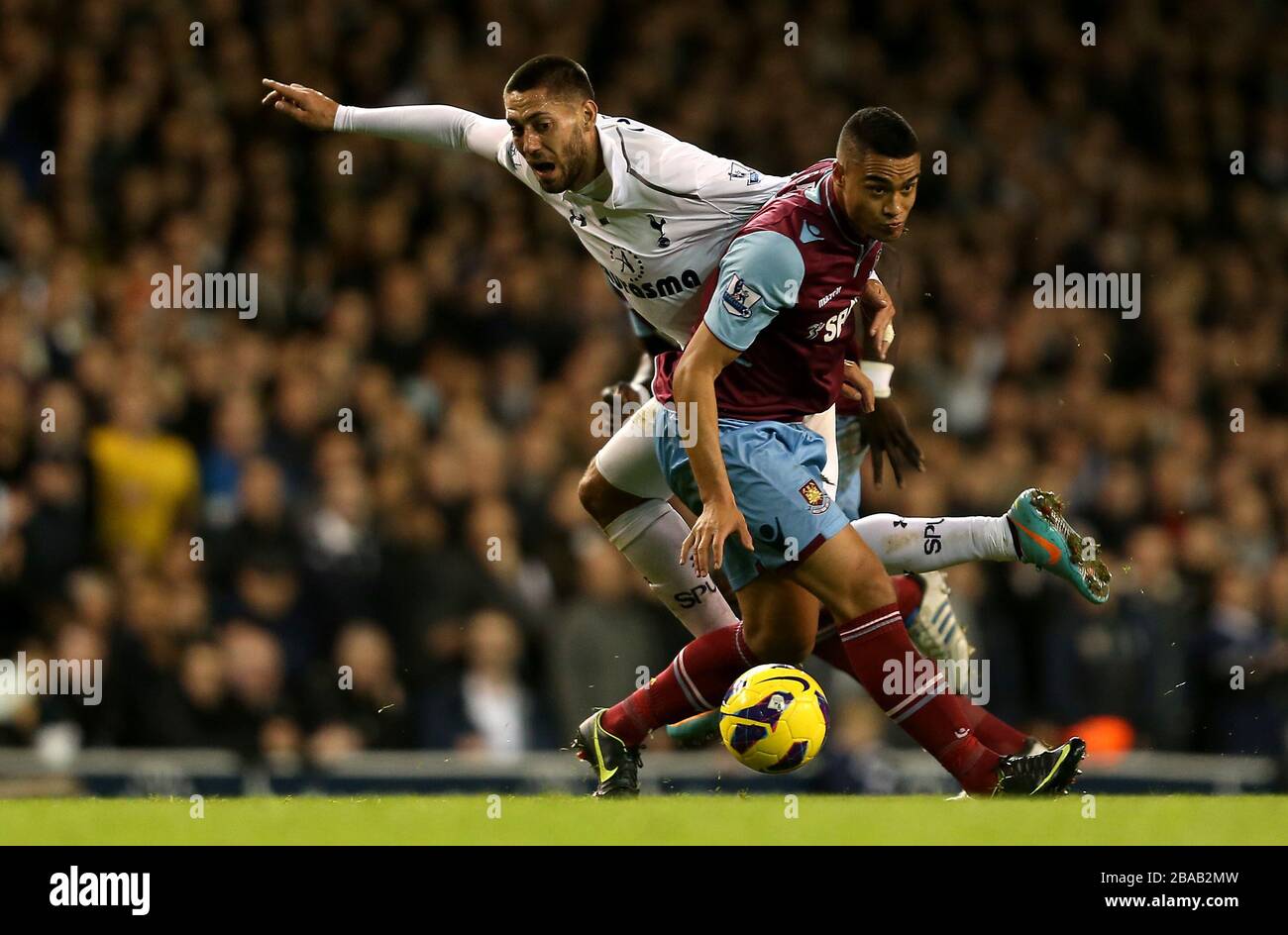 West Ham United's Winston Reid and Tottenham Hotspur's Clint Dempsey battle for the ball Stock Photo