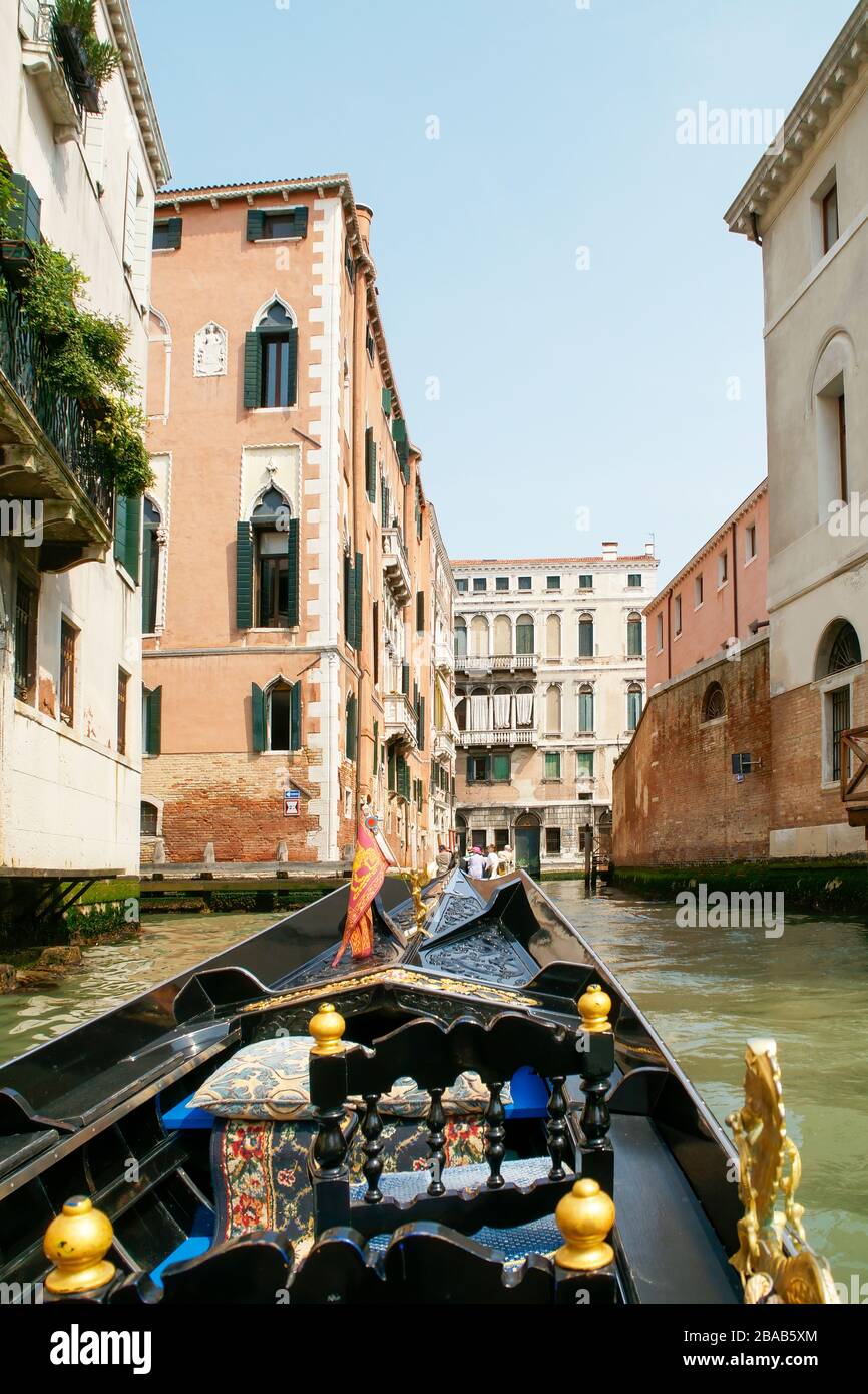 View while riding in a gondola showing buildings on both sides of the canal. Venice, Italy. Stock Photo